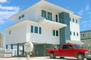 Modern coastal piling home in Navarre by Acorn Fine Homes - Thumb Pic 1