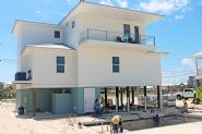 Modern coastal piling home in Navarre by Acorn Fine Homes - Thumb Pic 4