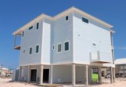 Modern coastal piling home in Navarre by Acorn Fine Homes - Thumb Pic 3