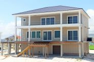 Modern coastal piling home in Navarre by Acorn Fine Homes - Thumb Pic 4