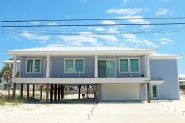 Modern coastal piling home in Navarre by Acorn Fine Homes - Thumb Pic 1