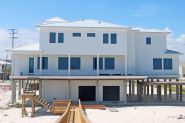 Modern coastal piling home in Navarre by Acorn Fine Homes - Thumb Pic 3