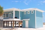 Modern coastal piling home in Navarre by Acorn Fine Homes - Thumb Pic 2