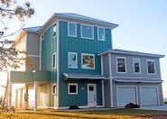 Modern piling home in Navarre, Gulf Breeze, Milton by Acorn Fine Homes