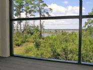 Wire rope railing in screen porch by Acorn Construction - Thumb Pic 12