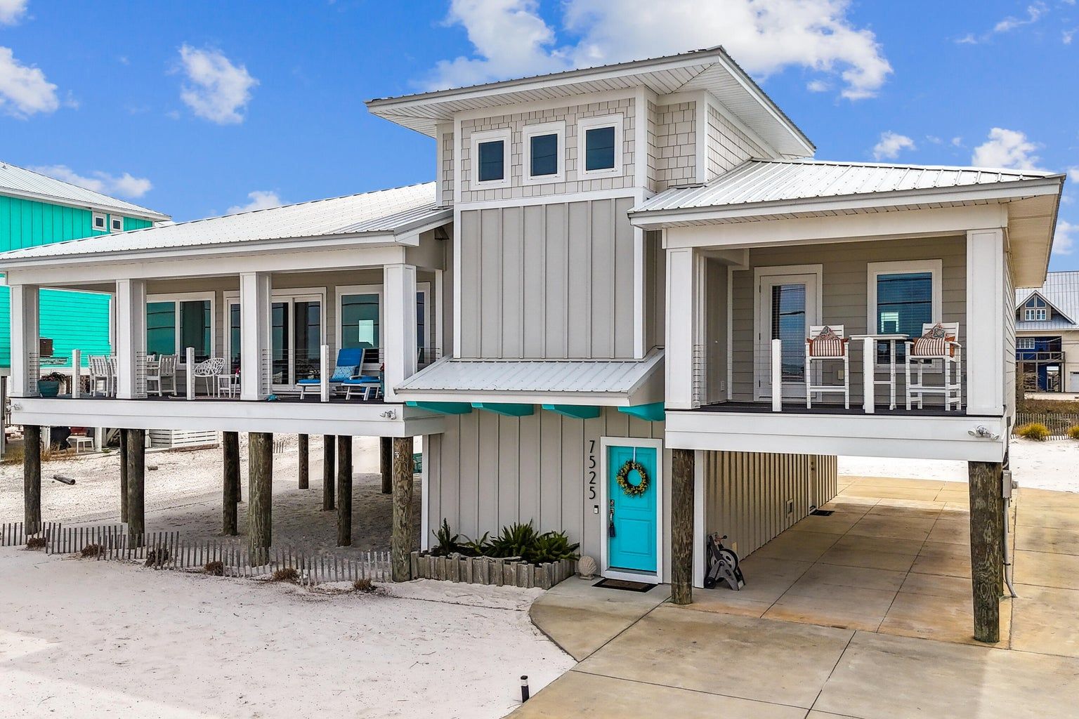 Moreland modern piling home on Navarre Beach by Acorn Fine Homes