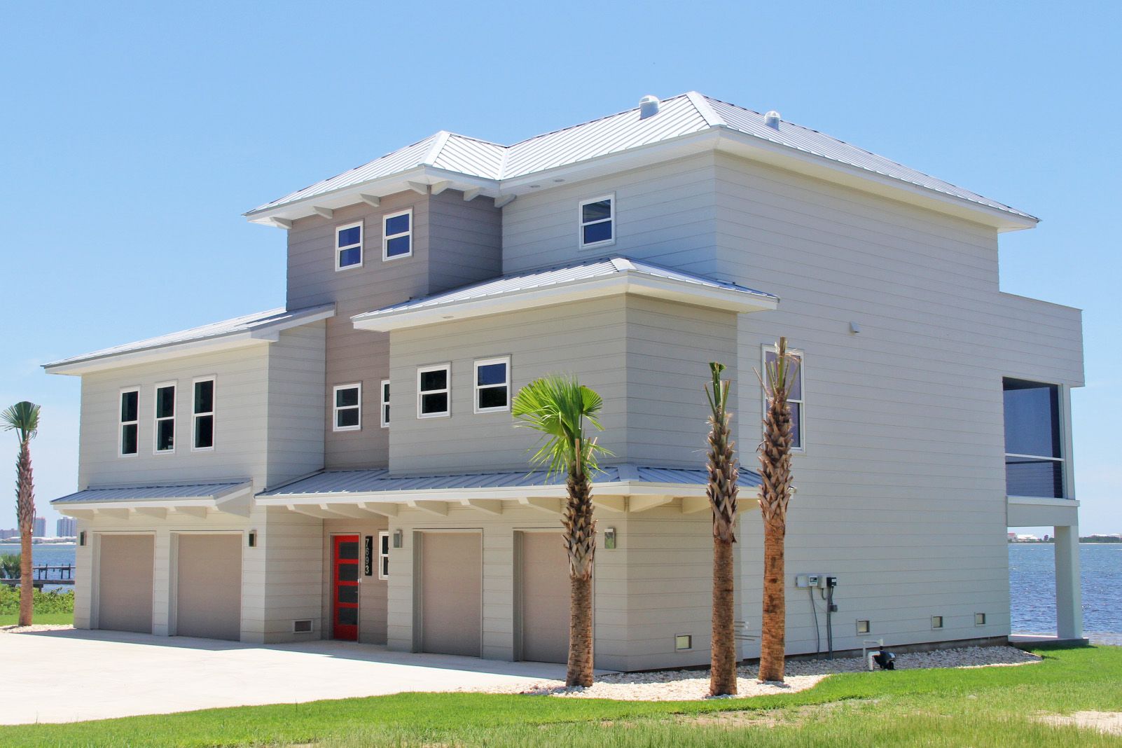 Modern piling home in Navarre by Acorn Fine Homes