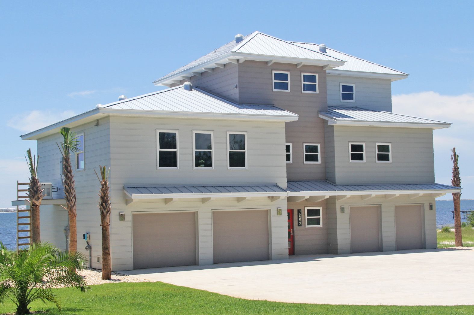 Modern piling home in Navarre by Acorn Fine Homes