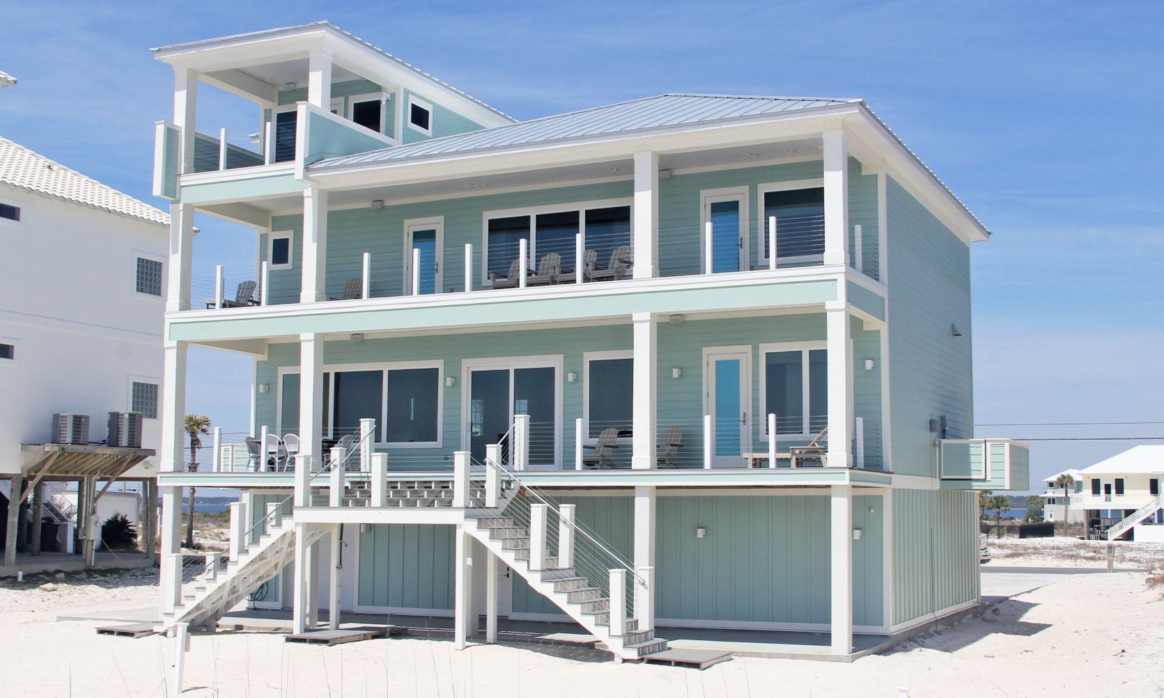 Antinnes concrete piling home on Navarre Beach by Acorn Fine Homes