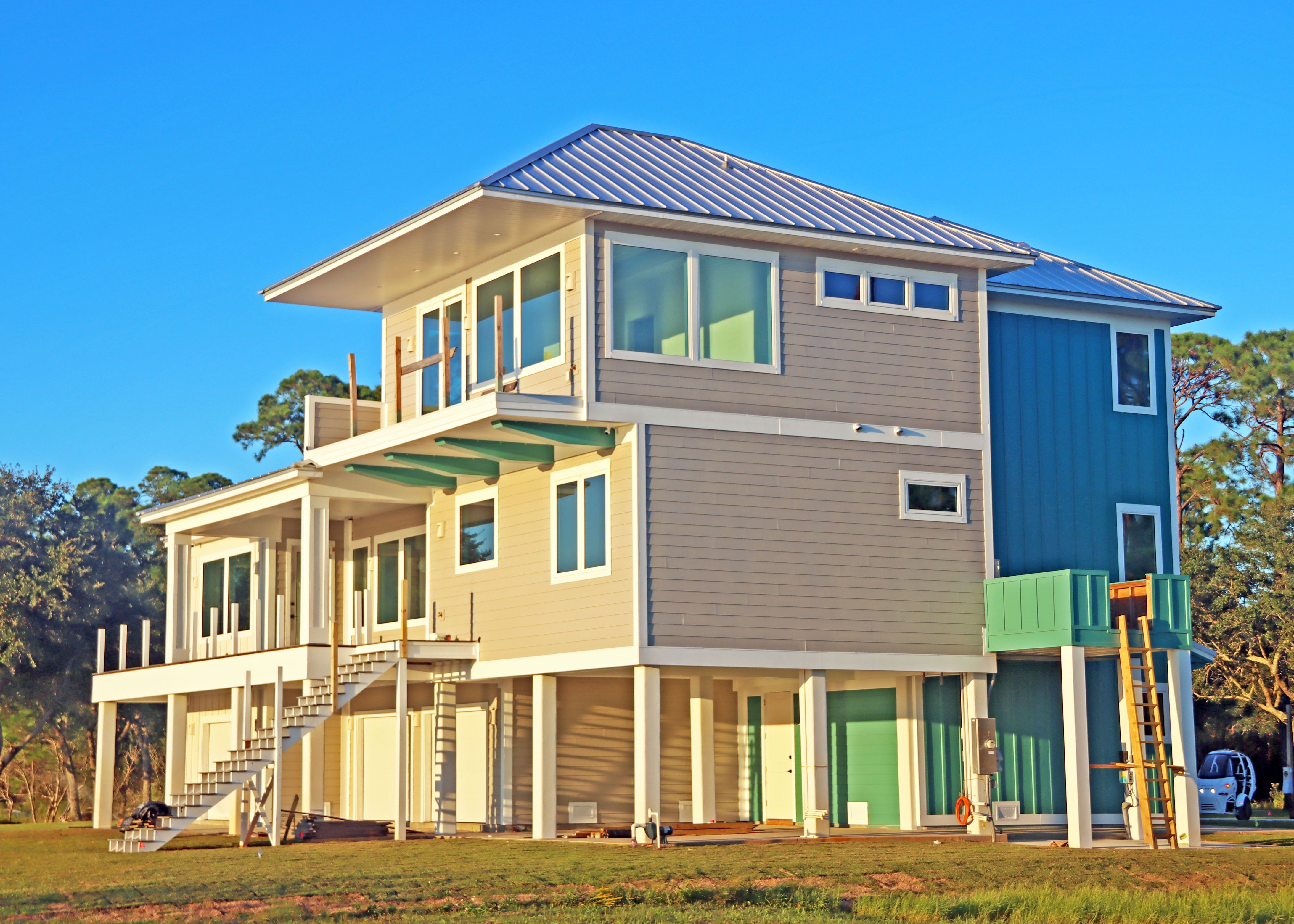 Modern piling home in Navarre, Gulf Breeze, Milton by Acorn Fine Homes