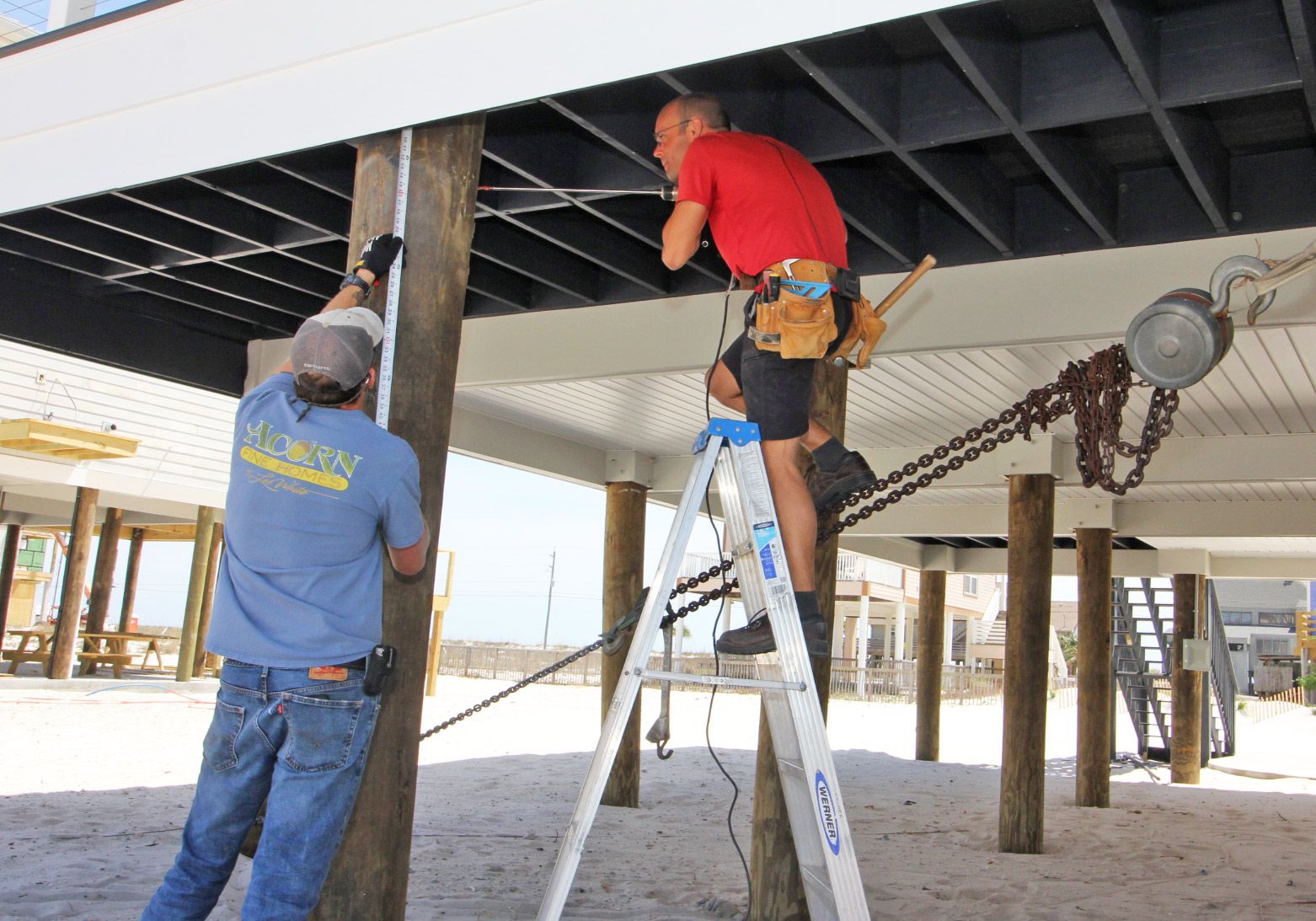 Moreland modern piling home on Navarre Beach by Acorn Fine Homes