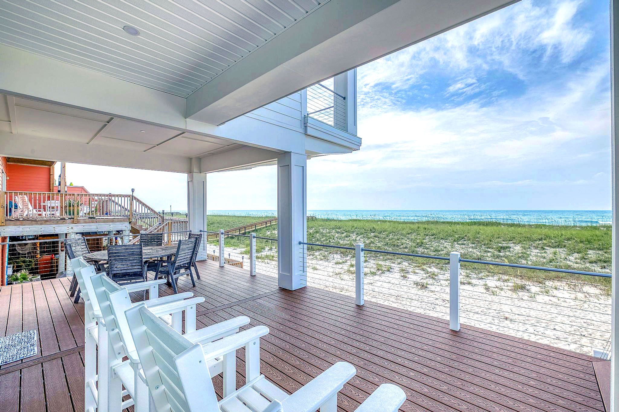 Modern coastal piling home in Navarre by Acorn Fine Homes