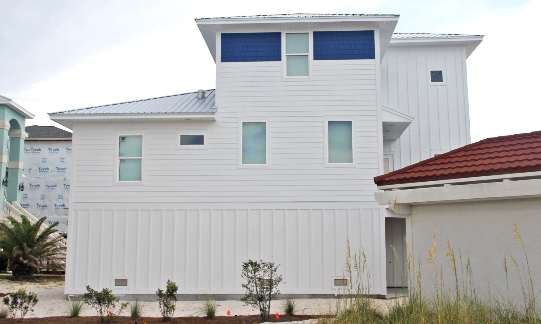 Slone modern coastal piling home on Navarre Beach by Acorn Fine Homes