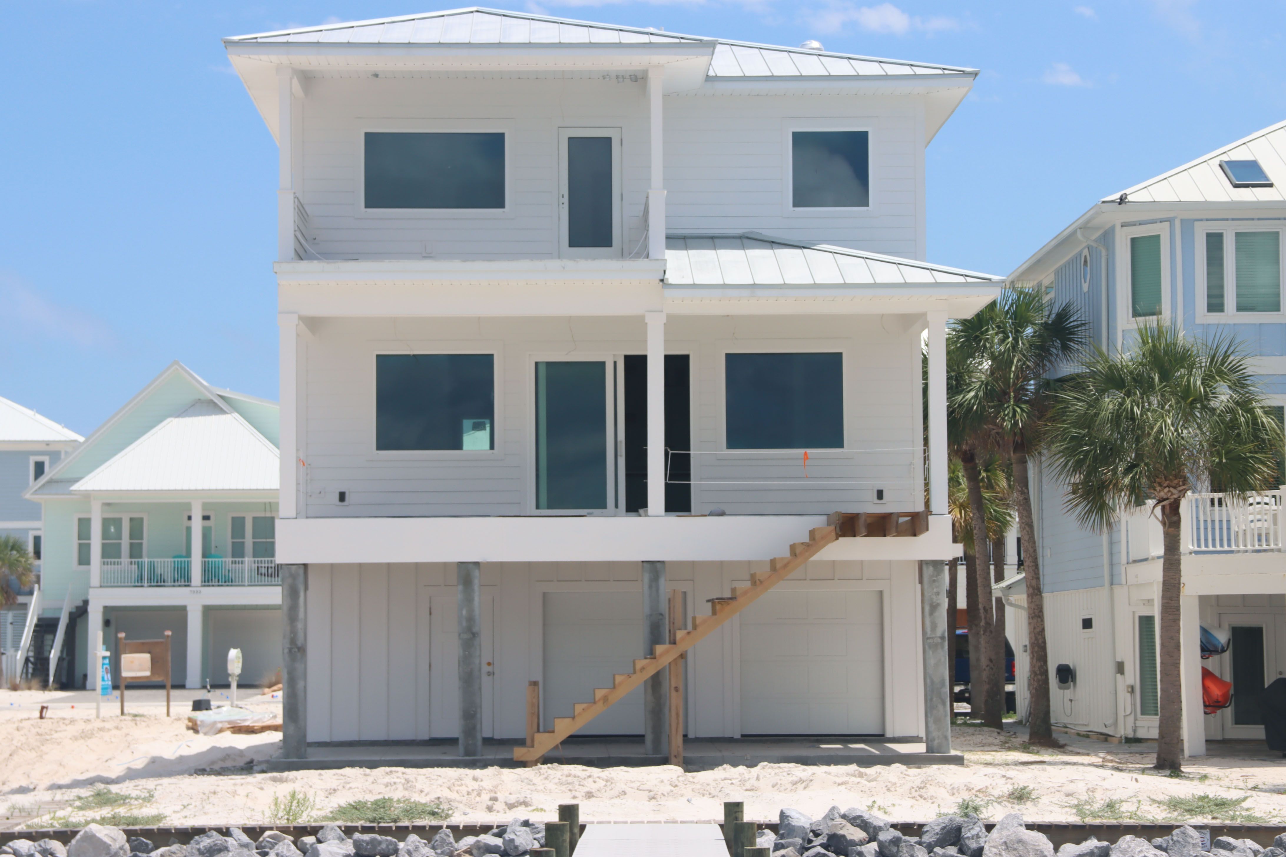 Modern coastal piling home in Navarre by Acorn Fine Homes