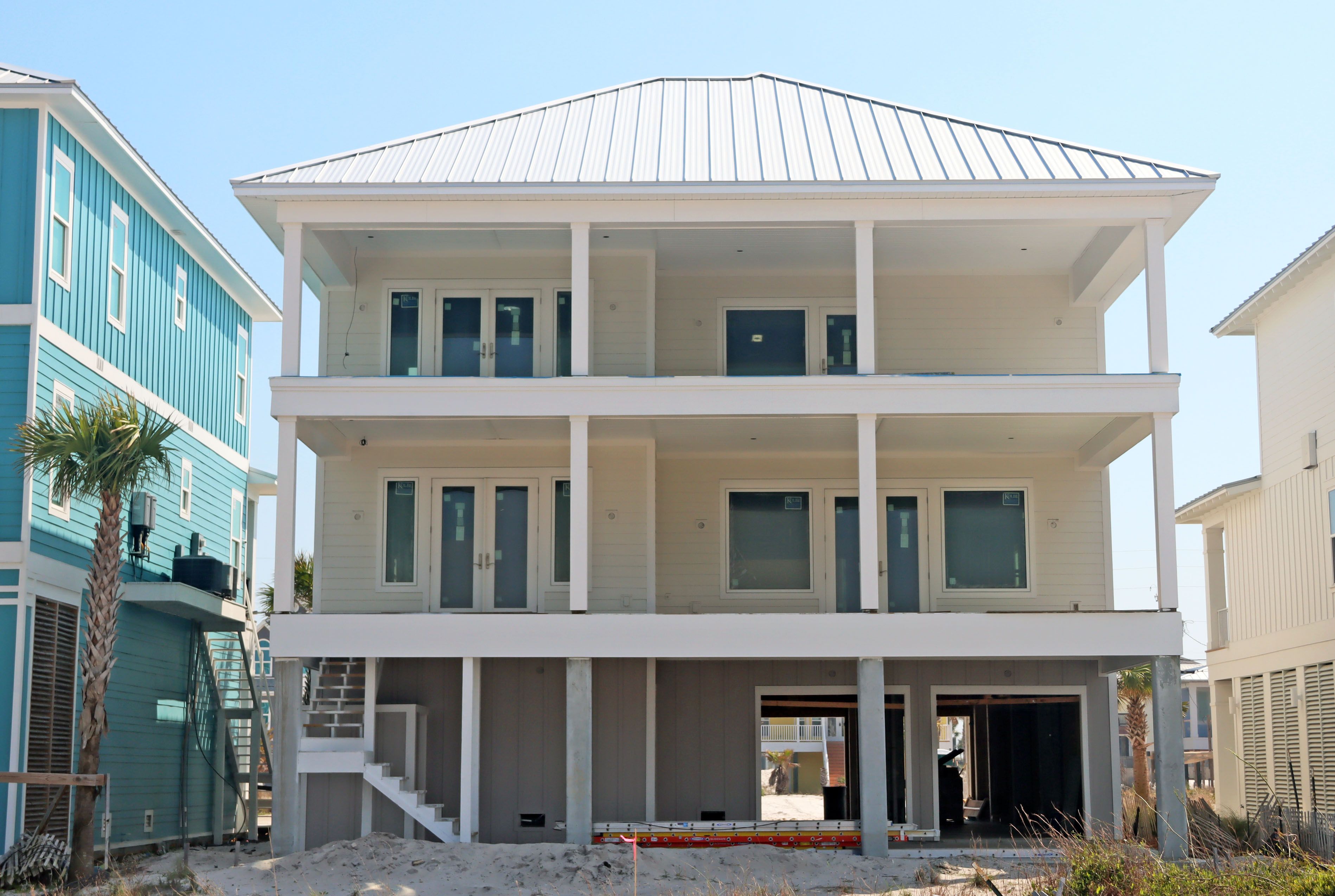 Modern coastal piling home in Navarre by Acorn Fine Homes