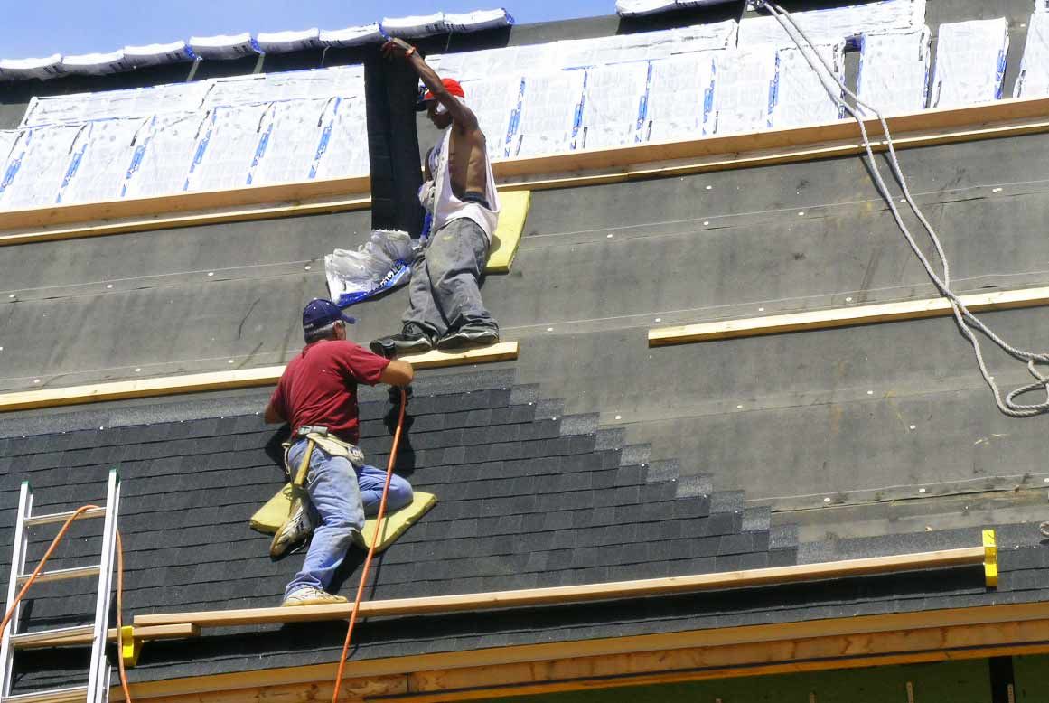 Installing shingles on the Spear job