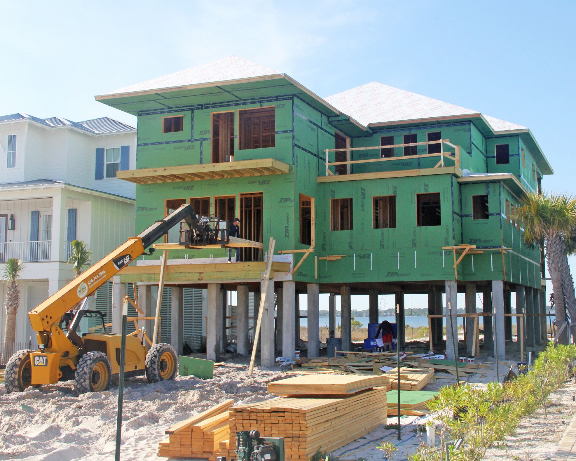 Modern piling home in Navarre by Acorn Fine Homes