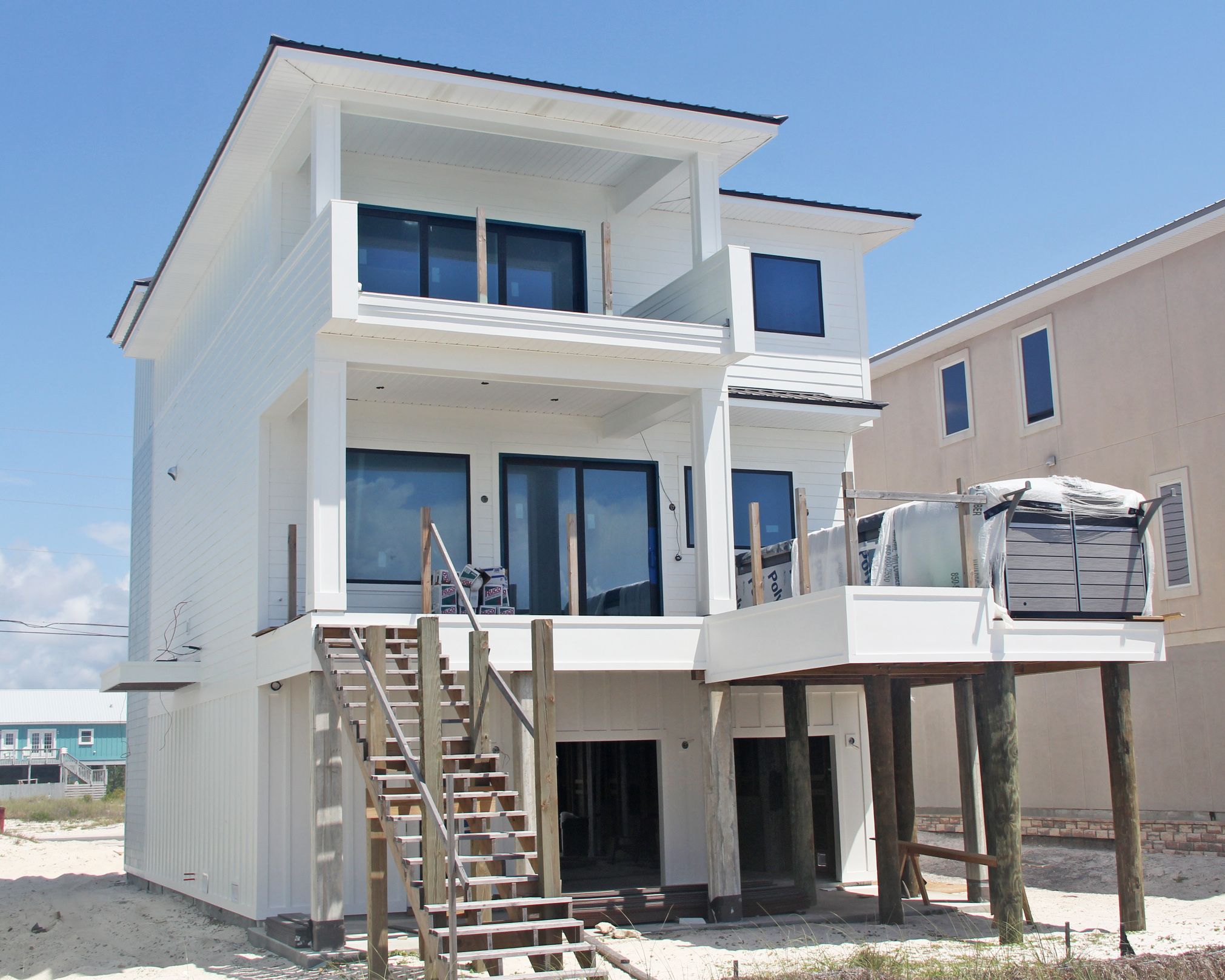 Davis modern coastal piling home on Navarre Beach by Acorn Fine Homes