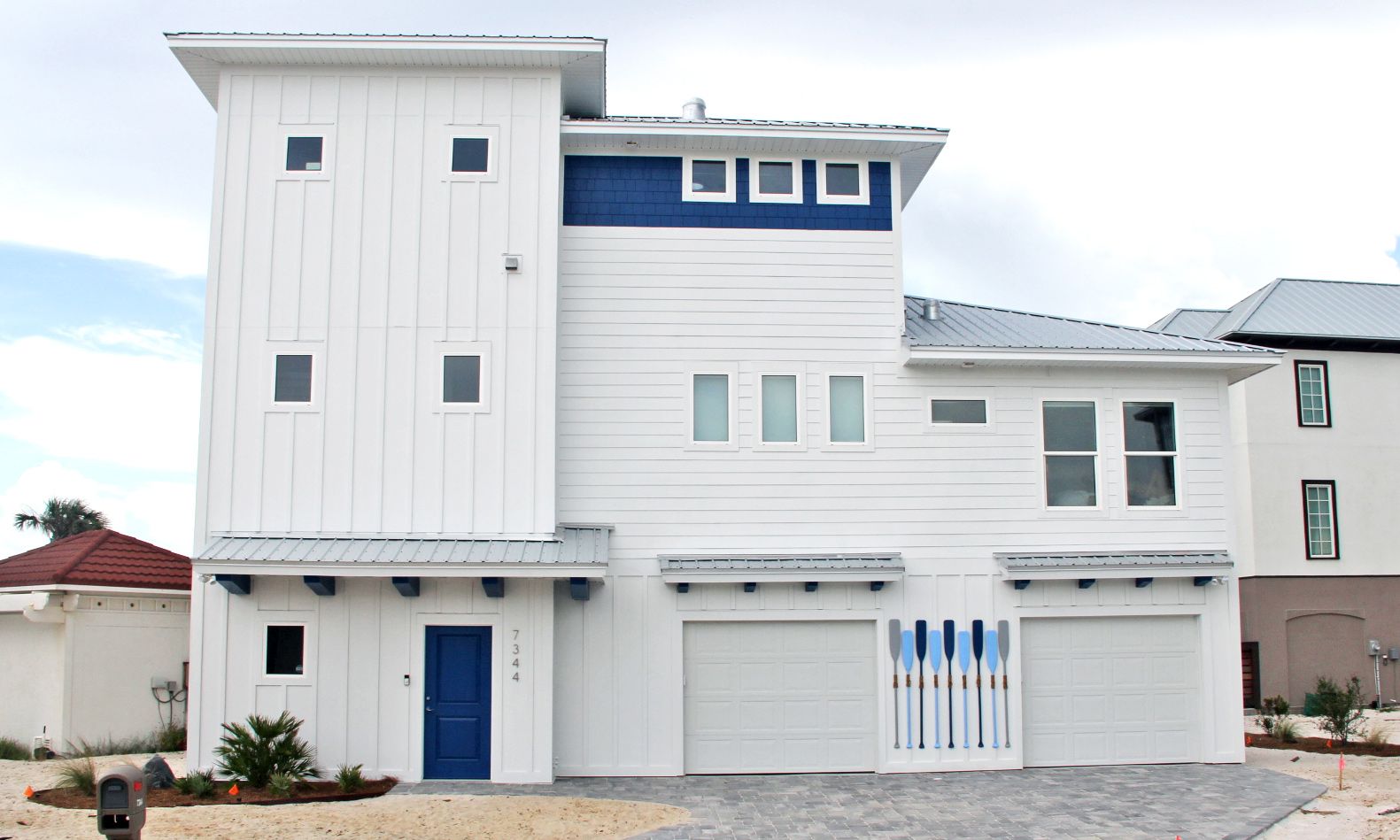 Slone modern coastal piling home on Navarre Beach by Acorn Fine Homes