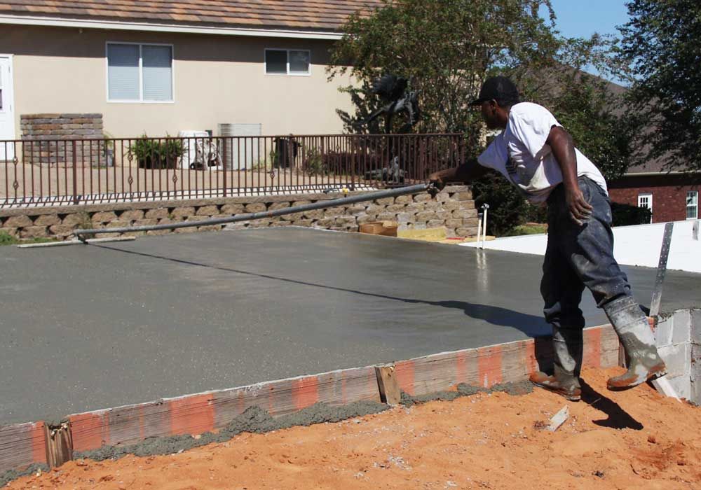 Acorn Construction bull floating a slab for a custom home in Pensacola