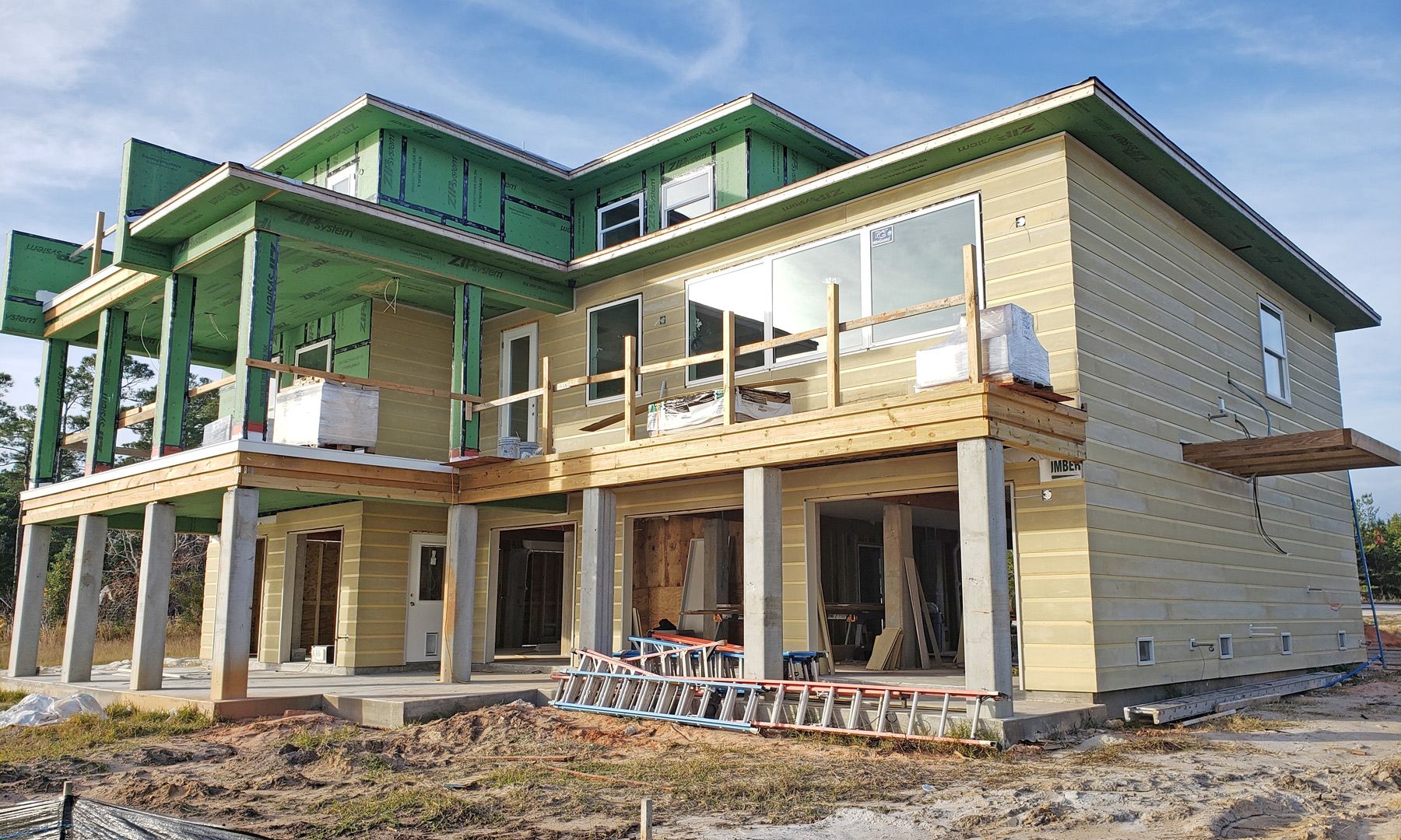 Modern piling home in Navarre by Acorn Fine Homes