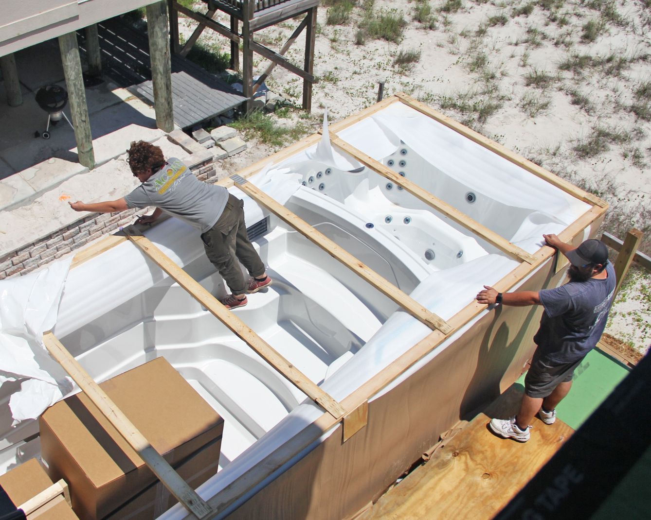 Davis modern coastal piling home on Navarre Beach by Acorn Fine Homes