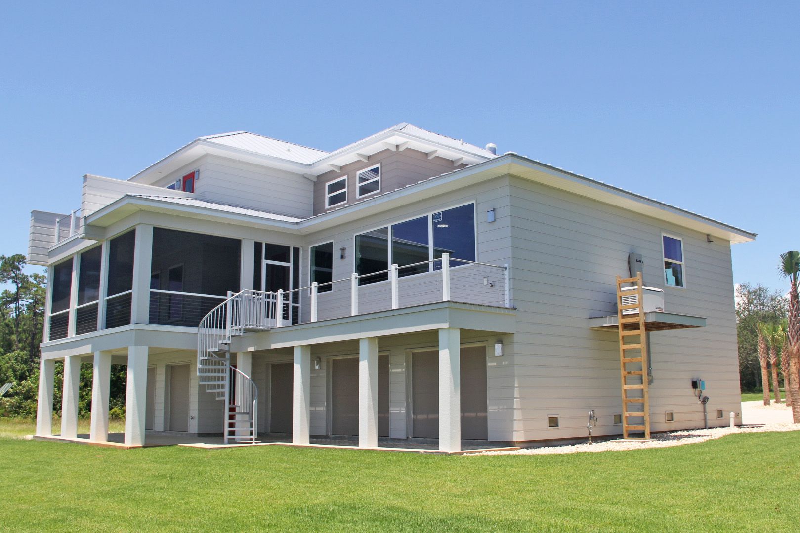 Modern piling home in Navarre by Acorn Fine Homes