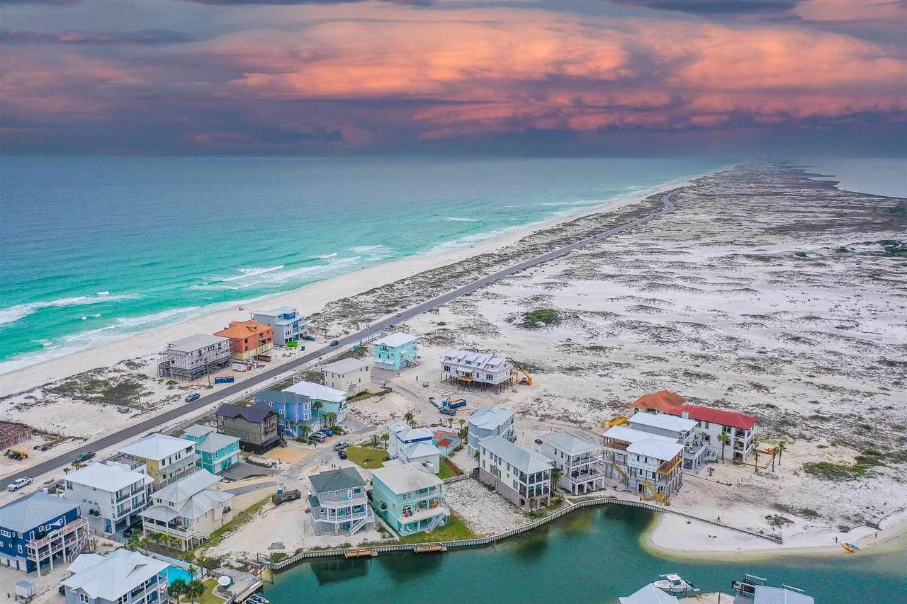 Modern coastal piling home in Navarre by Acorn Fine Homes