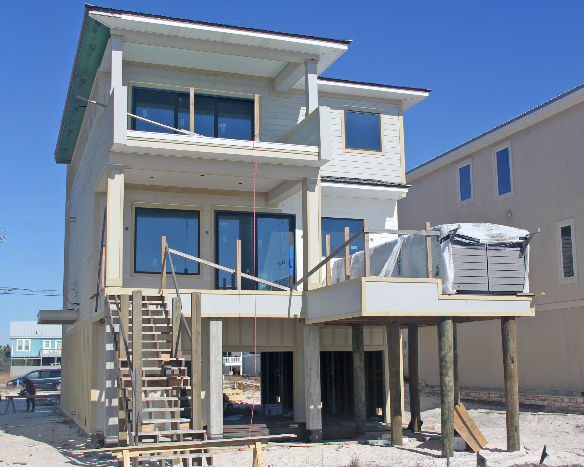 Davis modern coastal piling home on Navarre Beach by Acorn Fine Homes