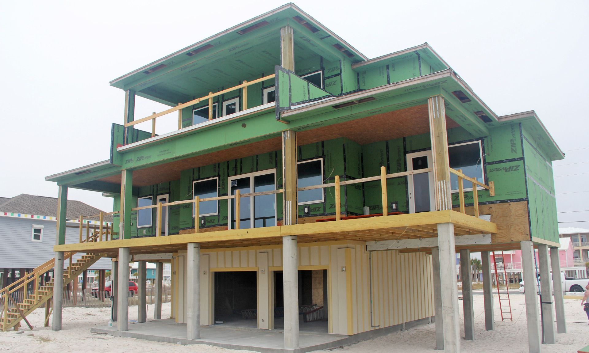 Burchard modern coastal style piling home on Navarre by Acorn Fine Homes