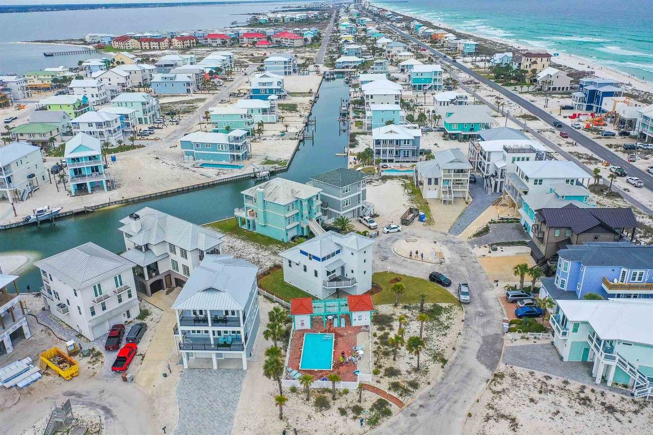 Slone modern coastal piling home on Navarre Beach by Acorn Fine Homes