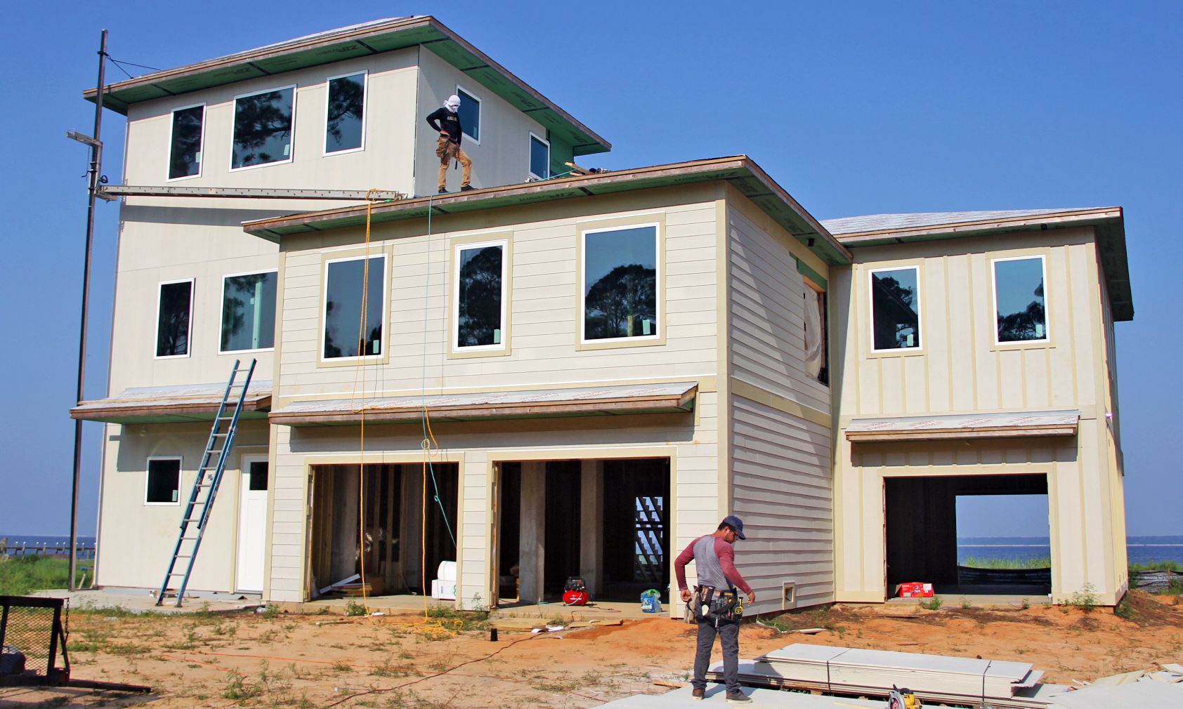 Modern piling home in Navarre by Acorn Fine Homes