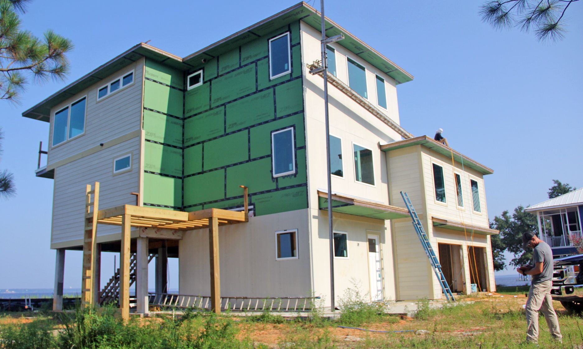 Modern piling home in Navarre by Acorn Fine Homes