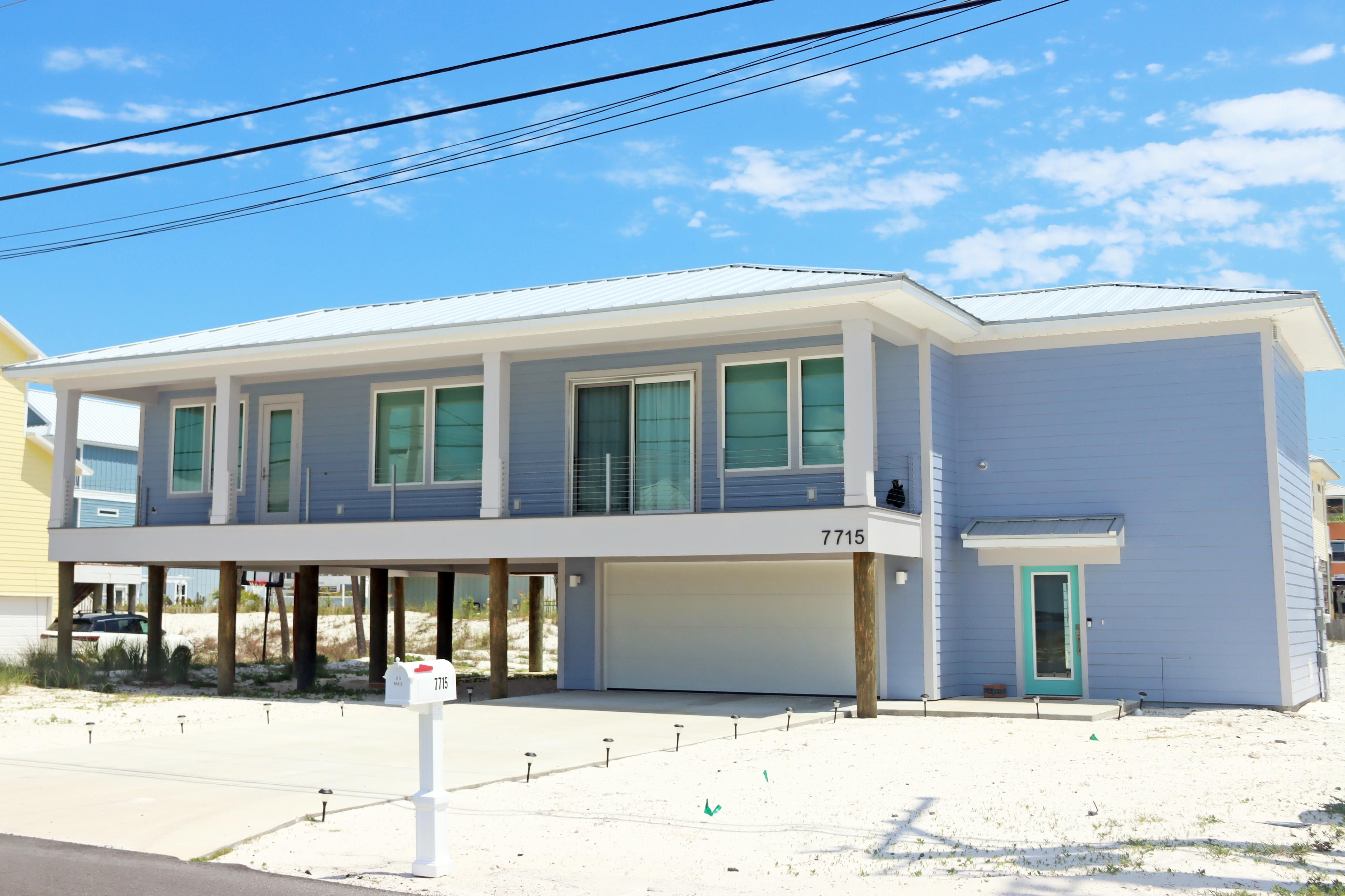 Modern coastal piling home in Navarre by Acorn Fine Homes