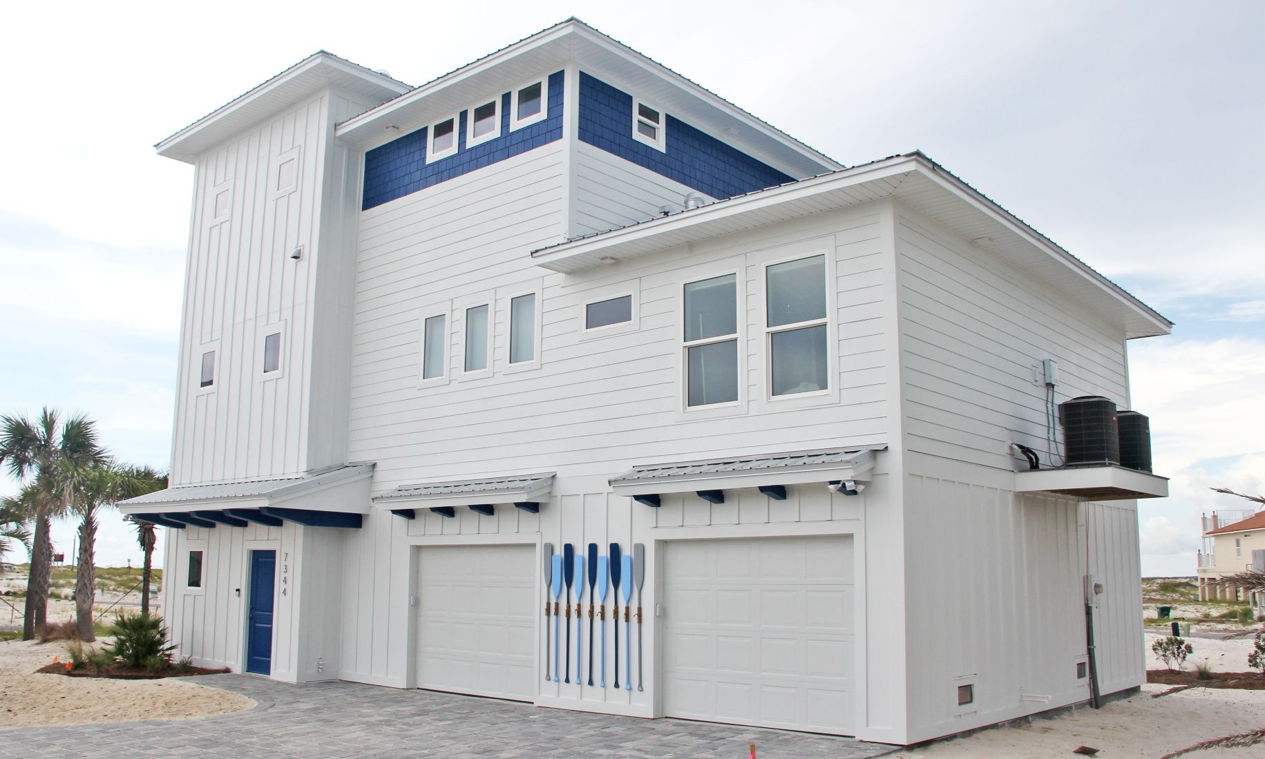 Slone modern coastal piling home on Navarre Beach by Acorn Fine Homes