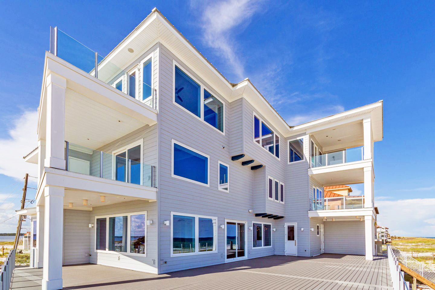 Modern coastal piling home in Navarre by Acorn Fine Homes