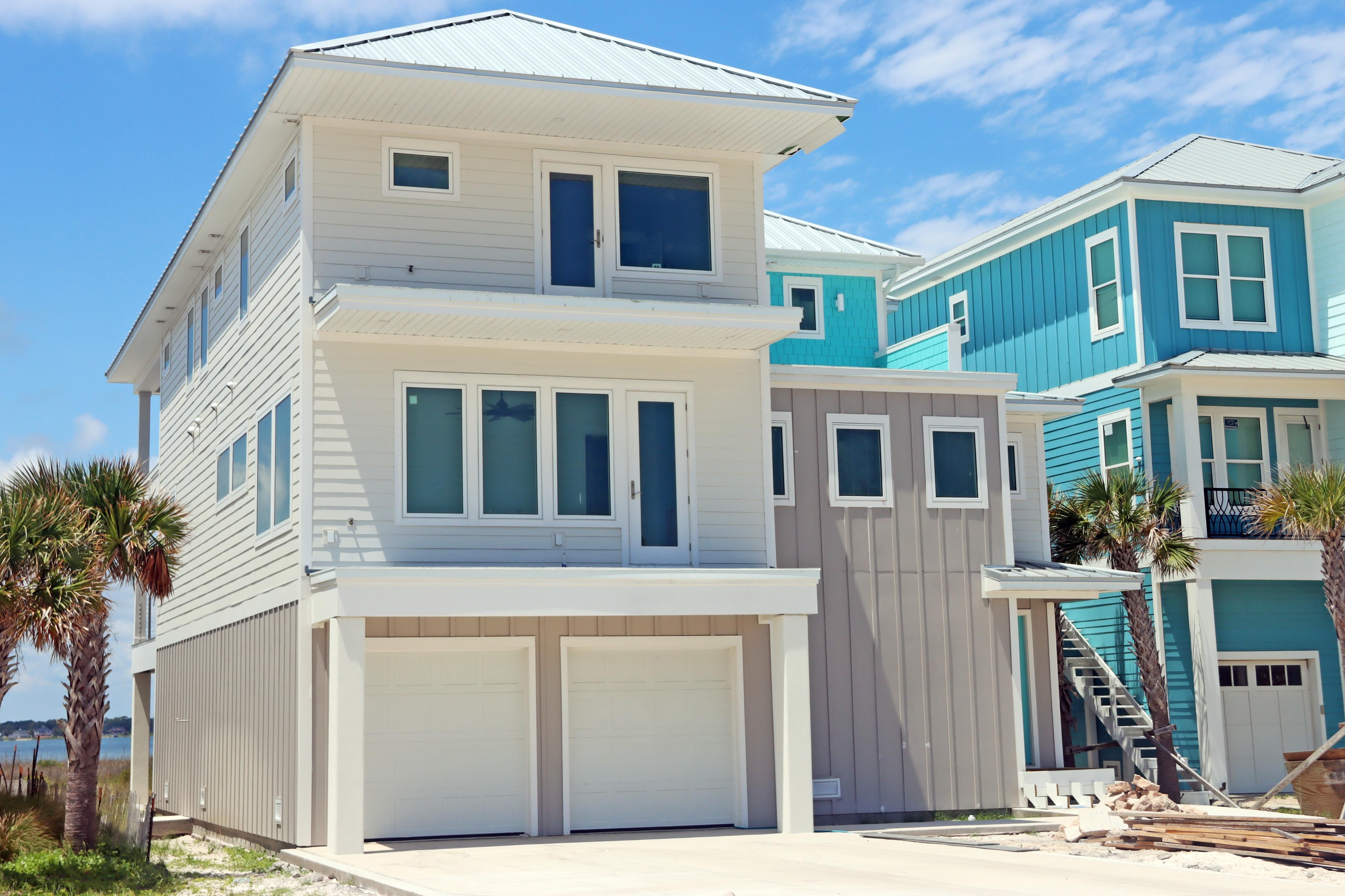 Modern coastal piling home in Navarre by Acorn Fine Homes