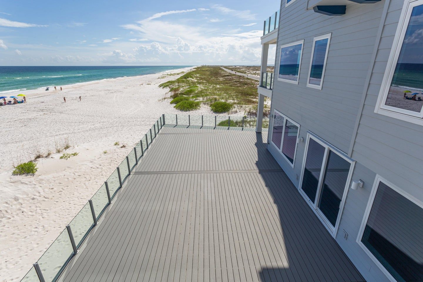 Modern coastal piling home in Navarre by Acorn Fine Homes