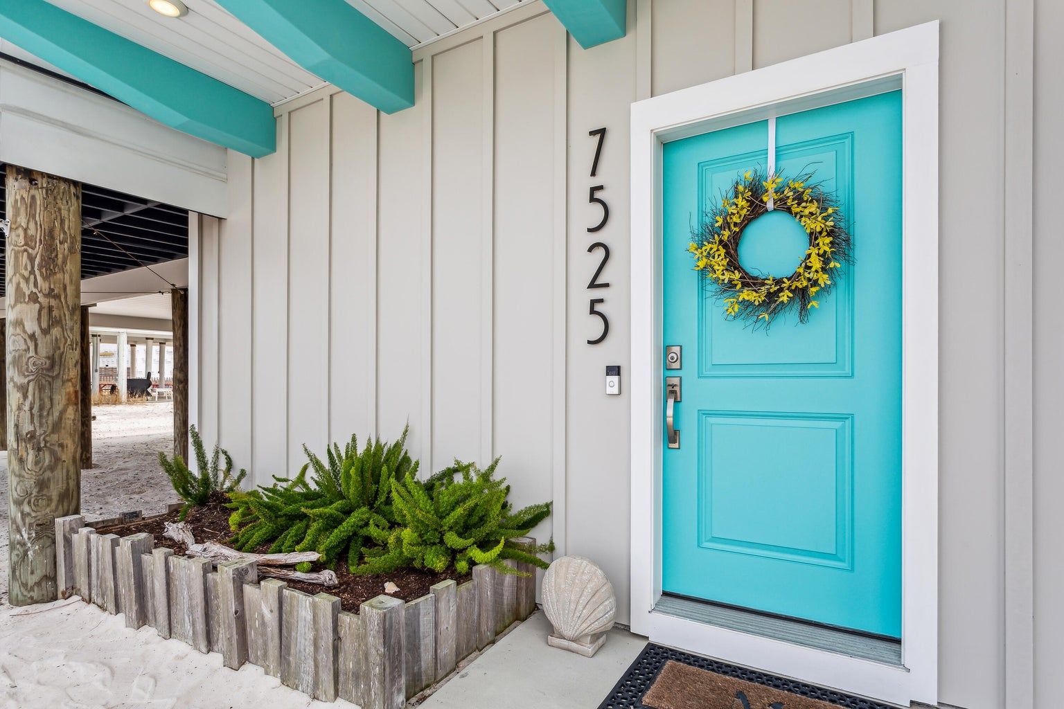 Modern coastal piling home in Navarre by Acorn Fine Homes