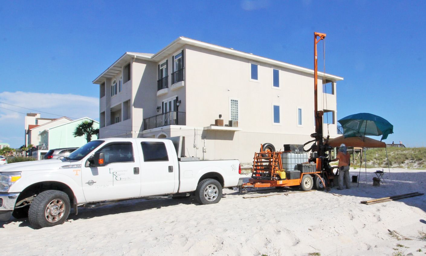 Davis modern coastal piling home on Navarre Beach by Acorn Fine Homes