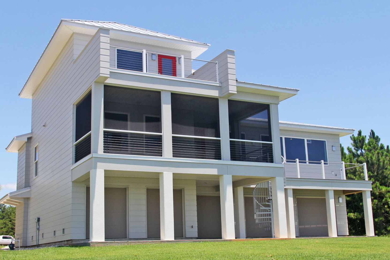 Modern piling home in Navarre by Acorn Fine Homes