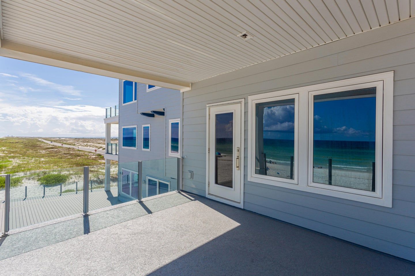 Modern coastal transitional style piling home on Navarre Beach