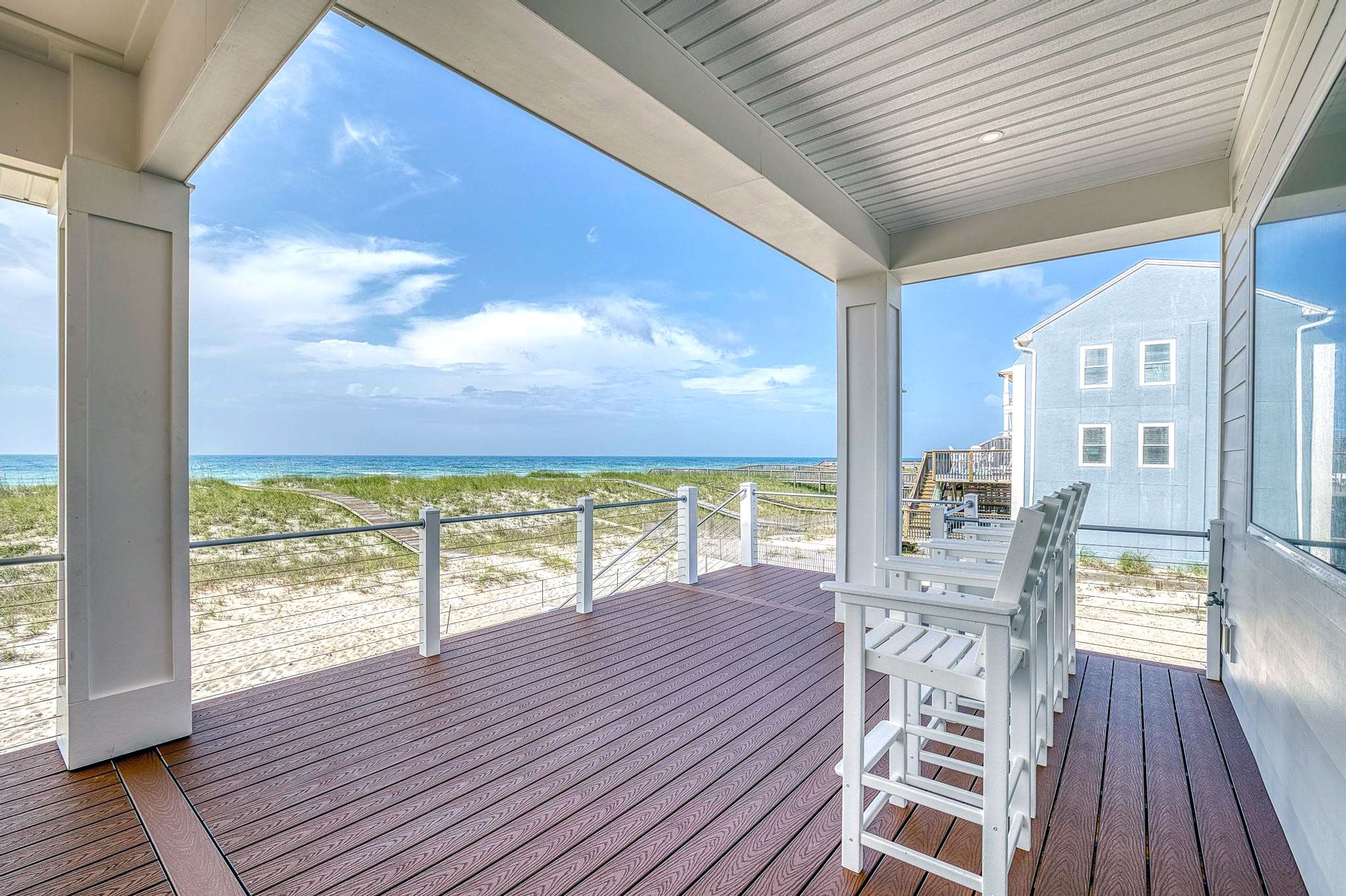 Modern coastal piling home in Navarre by Acorn Fine Homes