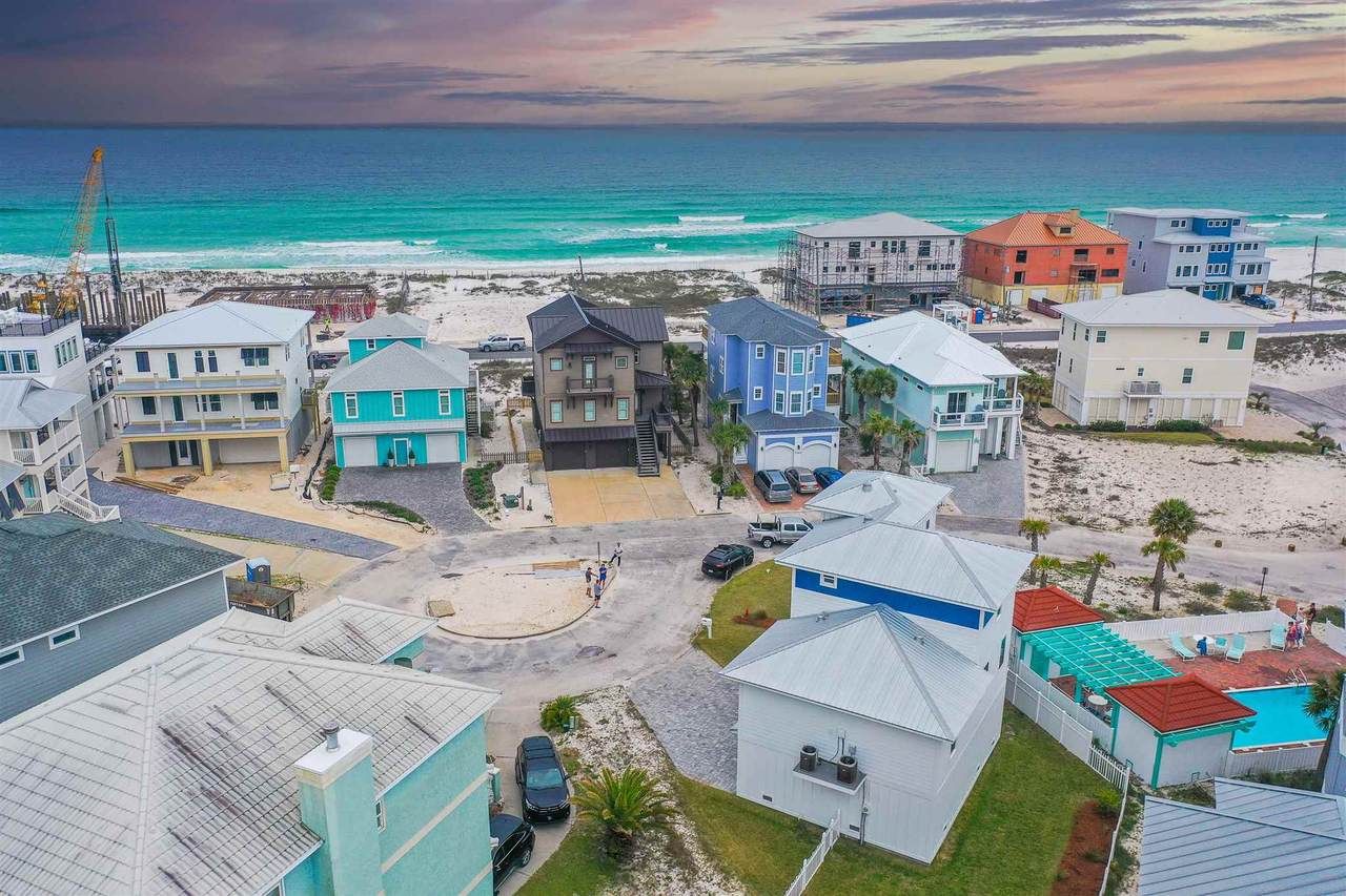 Slone modern coastal piling home on Navarre Beach by Acorn Fine Homes